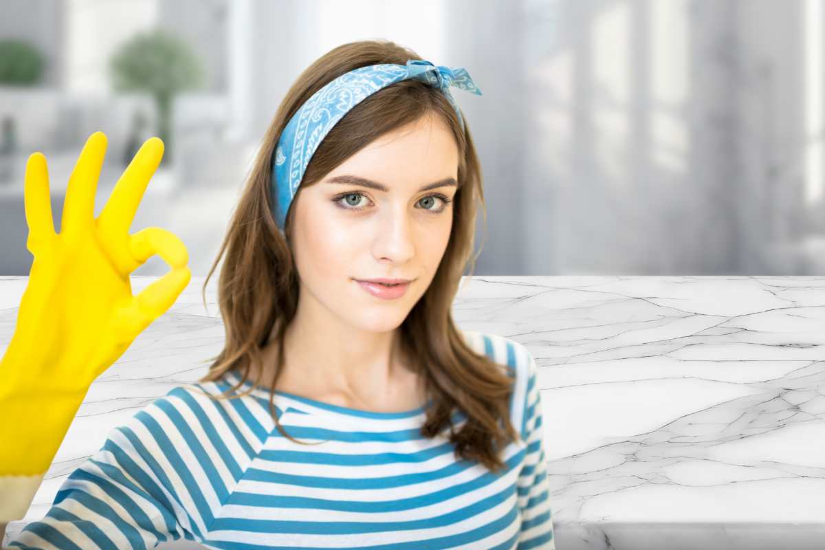 superficie marmo donna pulizie gesto ok